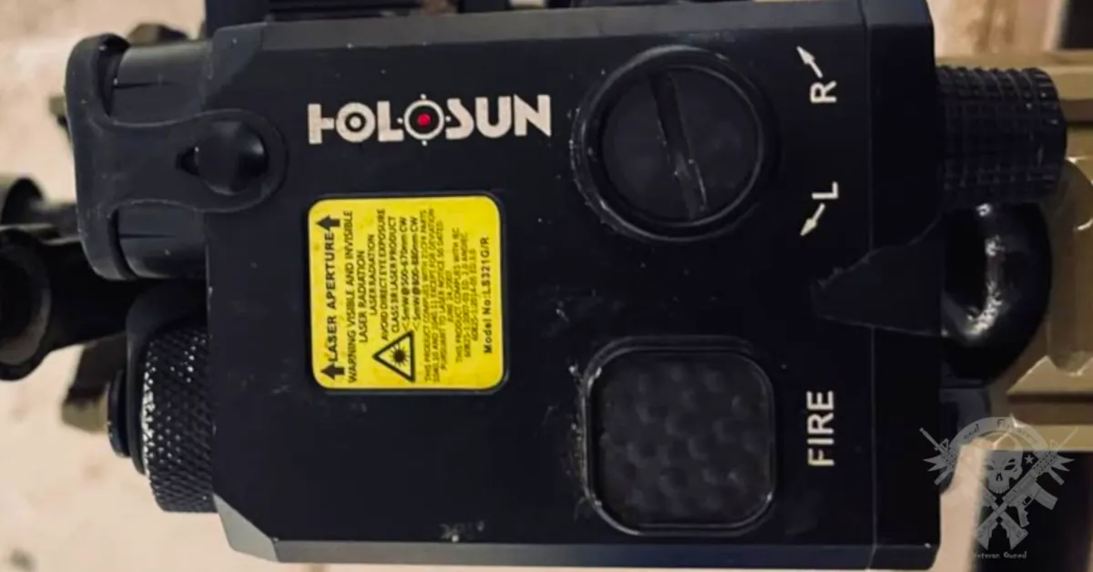 Holosun LS221G-IR tactical laser sight showing warning labels and dual laser system