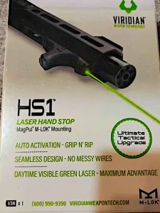 Front of Viridian HS1 Laser Hand Stop packaging showing green laser, auto activation, and M-LOK mount features