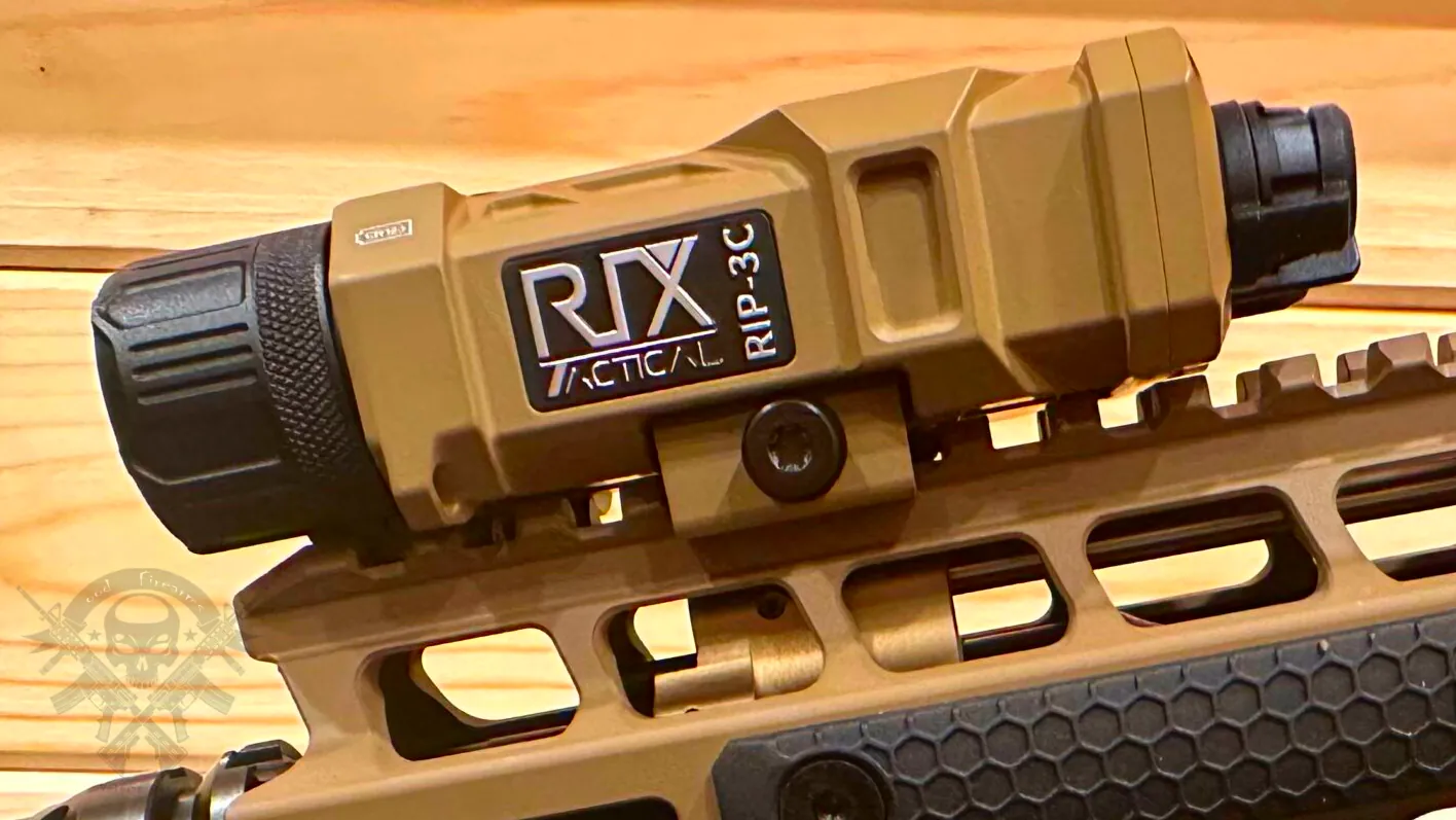 RIX RIP-3C IR laser sight mounted on a flat dark earth AR-15 handguard, showing side branding, tool-free adjustment turrets, and QD Picatinny mount in natural daylight.