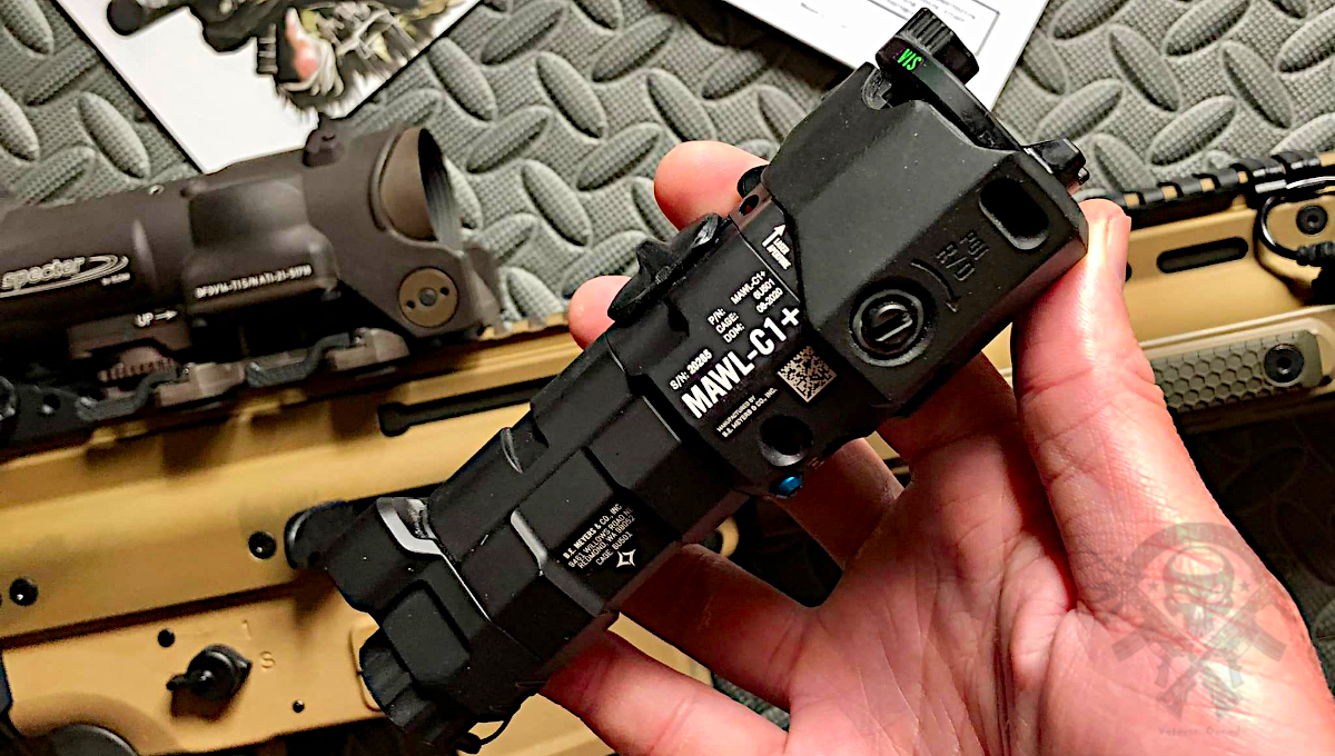 User holding the BE Meyers MAWL C1+ IR laser and illuminator mounted on an AR-15 rifle for night vision setup