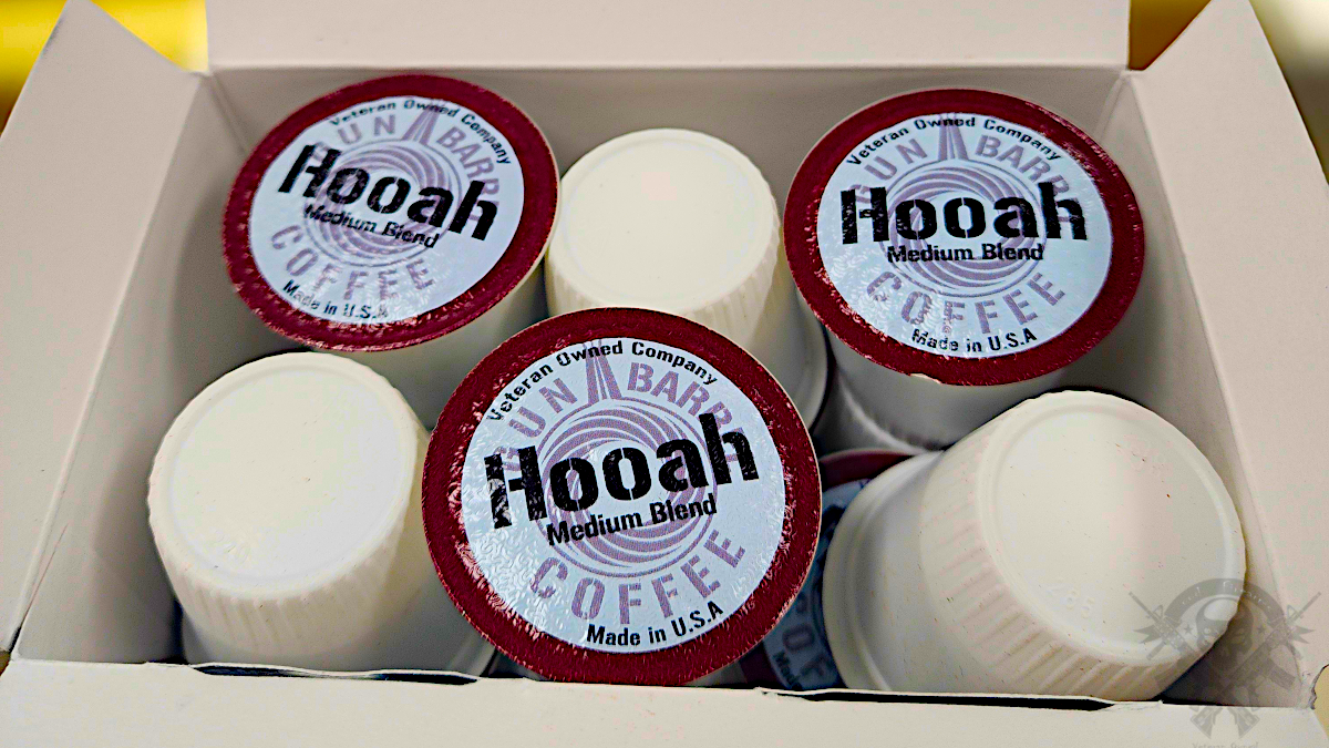 Gun Barrel Coffee Hooah K-Cups neatly arranged in a box, showing the medium roast pods labeled "Veteran Owned Company."