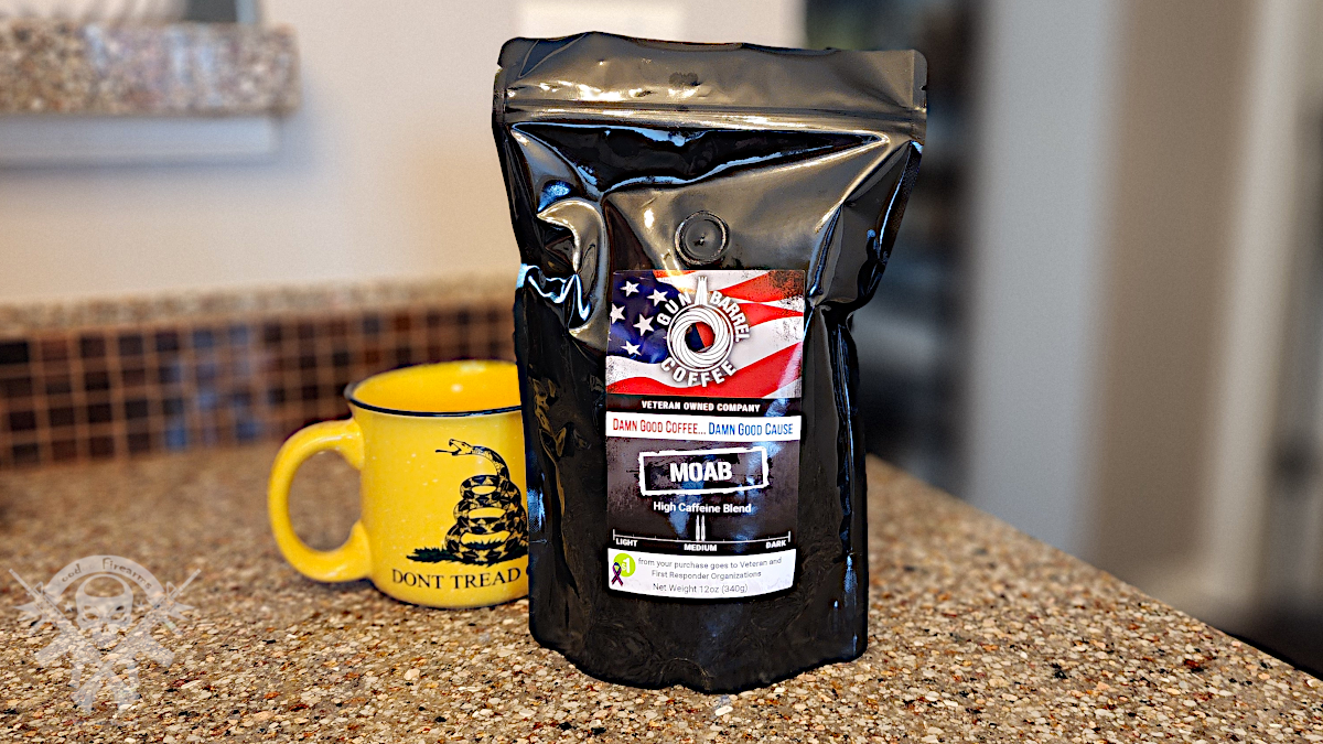 Gun Barrel Coffee MOAB bag with yellow Don’t Tread on Me mug on kitchen counter.